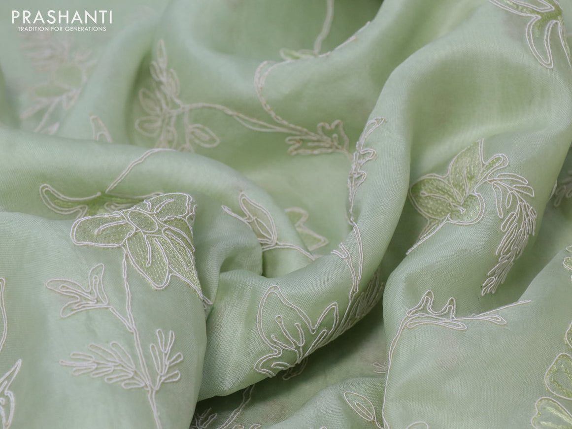 Pure organza silk saree mild paista green with floral design embroidery work weaves and embroidery work simple border