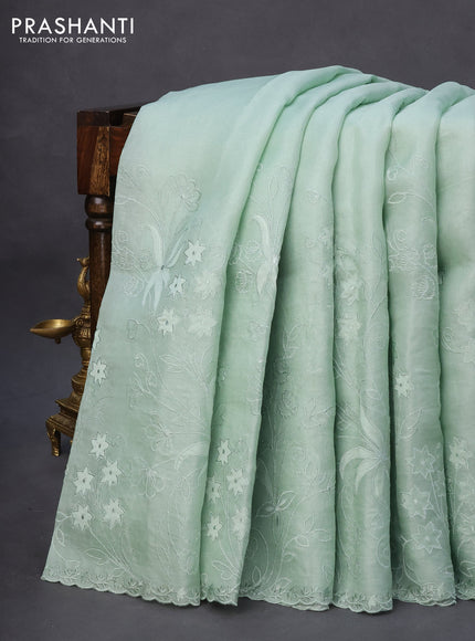 Pure organza silk saree pastel green with floral design embroidery work weaves and embroidery work simple border