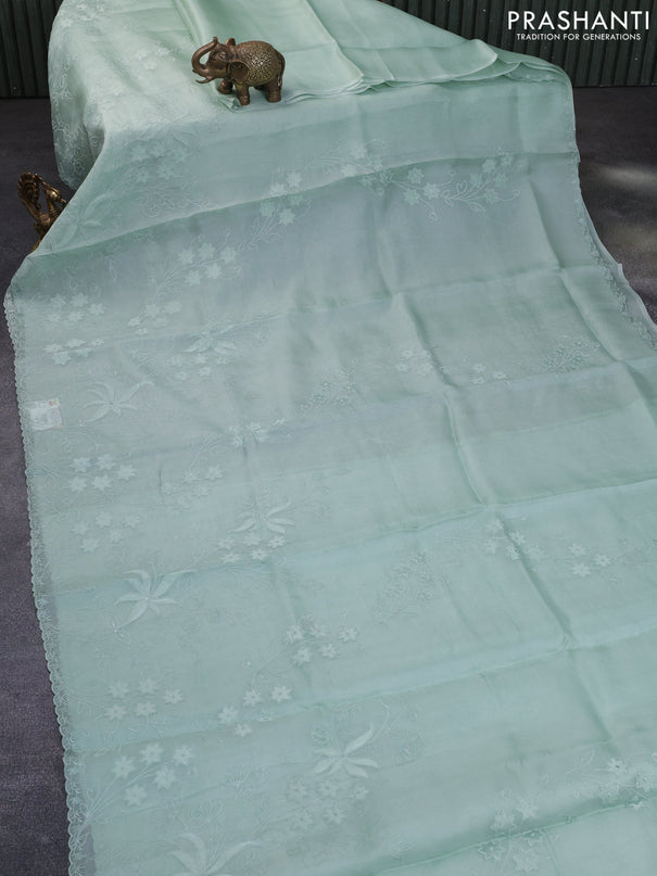 Pure organza silk saree pastel green with floral design embroidery work weaves and embroidery work simple border