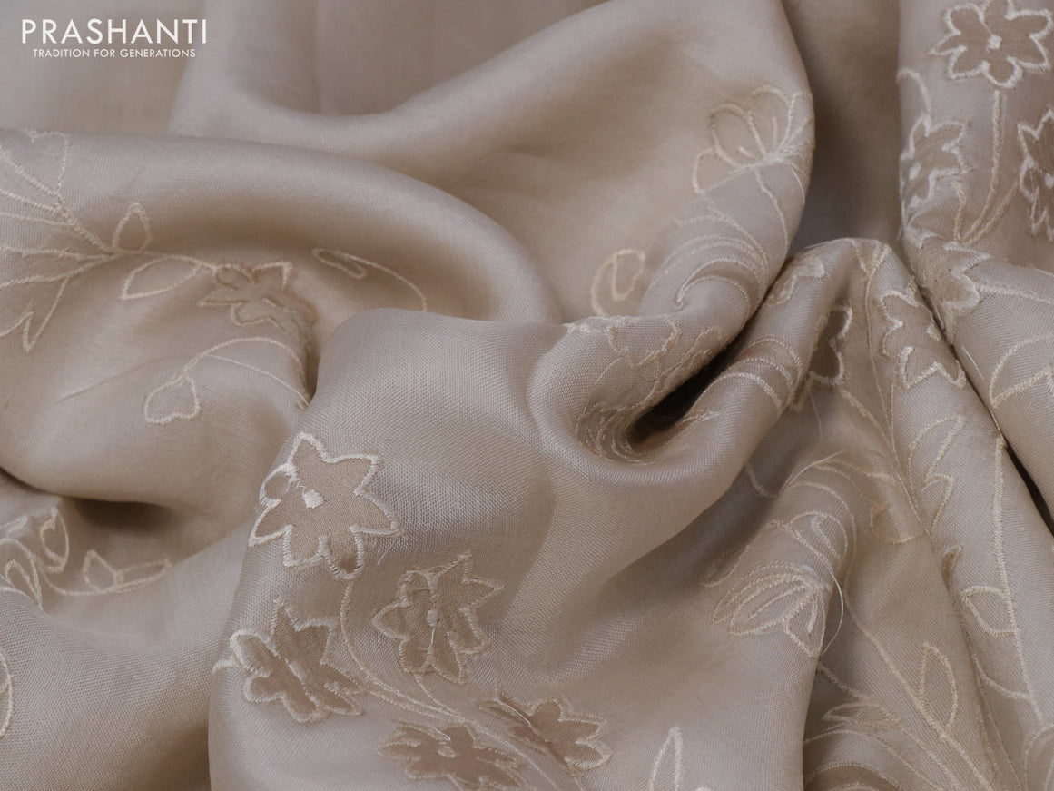 Pure organza silk saree cream with floral design embroidery work weaves and embroidery work simple border