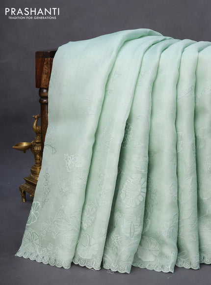 Pure organza silk saree pastel green with floral design embroidery work weaves and embroidery work simple border