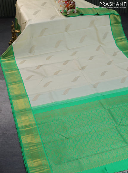 Pure kanchipuram silk saree off white and green with zari woven leaf buttas and zari woven border