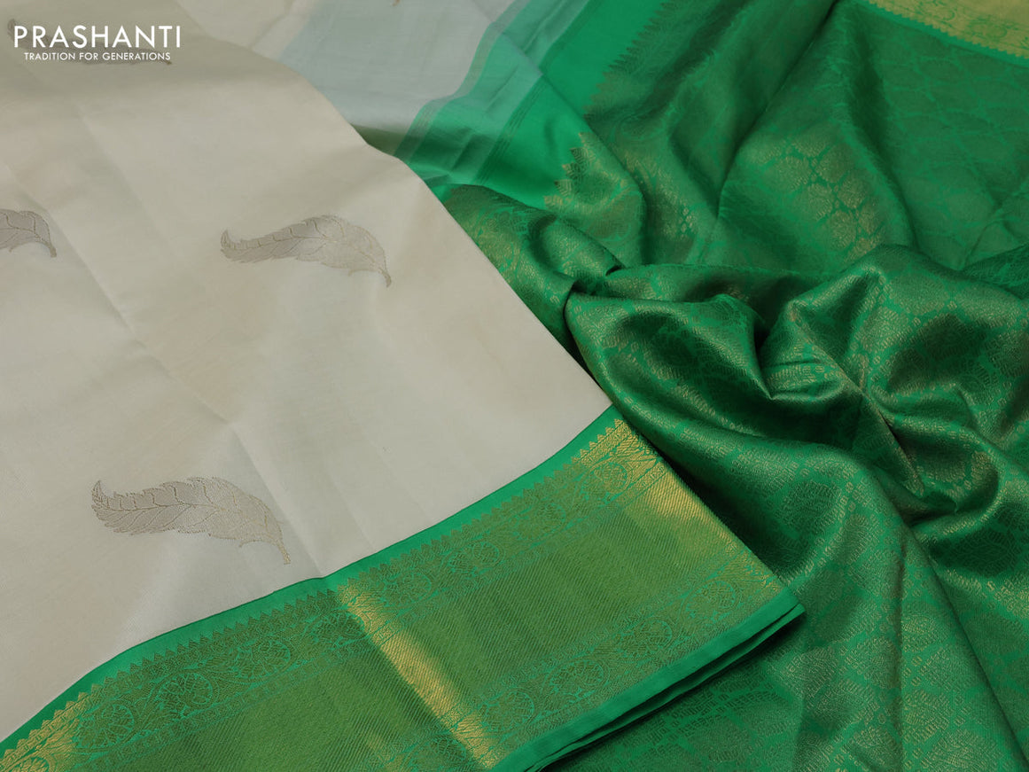 Pure kanchipuram silk saree off white and green with zari woven leaf buttas and zari woven border