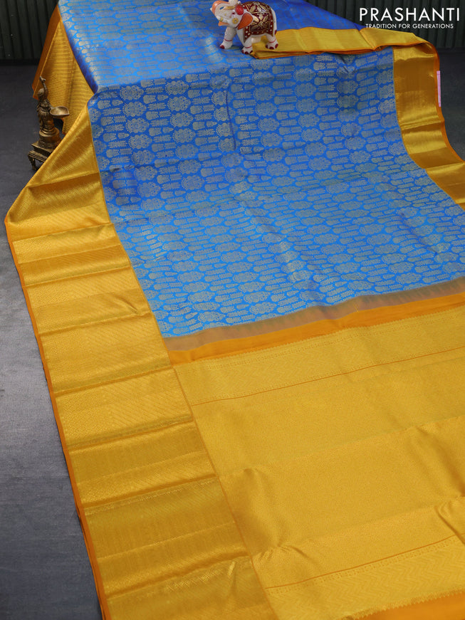 Pure kanchipuram silk saree cs blue and mustard yellow with allover zari woven brocade weaves and long zari woven border