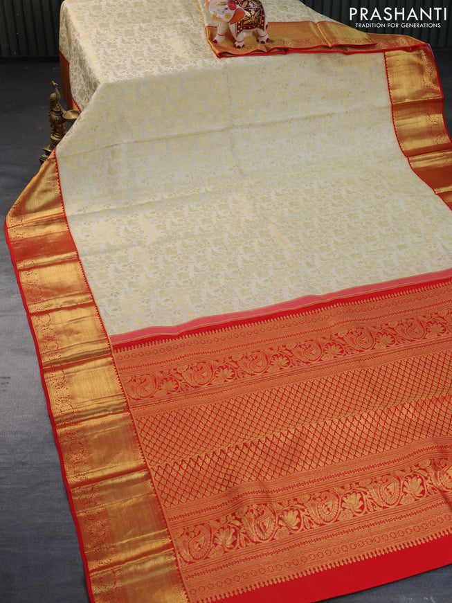 Pure kanchipuram silk saree cream and red with allover zari woven brocade weaves and zari woven border