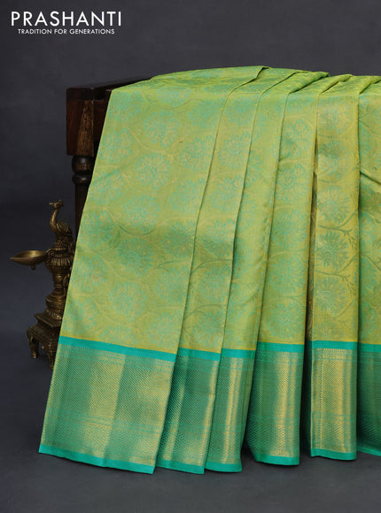 Pure kanchipuram tissue silk saree light green and teal blue with allover zari woven brocade weaves and zari woven border