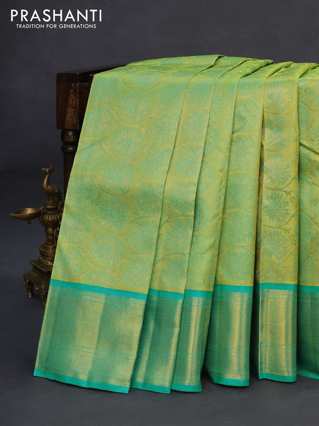 Pure kanchipuram tissue silk saree light green and teal blue with allover zari woven brocade weaves and zari woven border