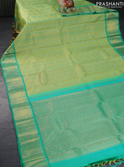 Pure kanchipuram tissue silk saree light green and teal blue with allover zari woven brocade weaves and zari woven border