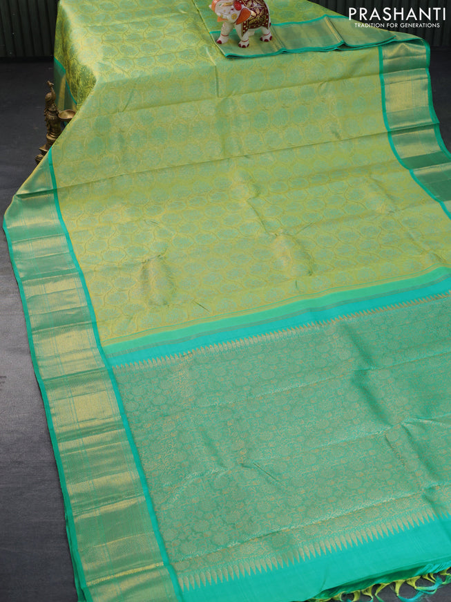 Pure kanchipuram tissue silk saree light green and teal blue with allover zari woven brocade weaves and zari woven border