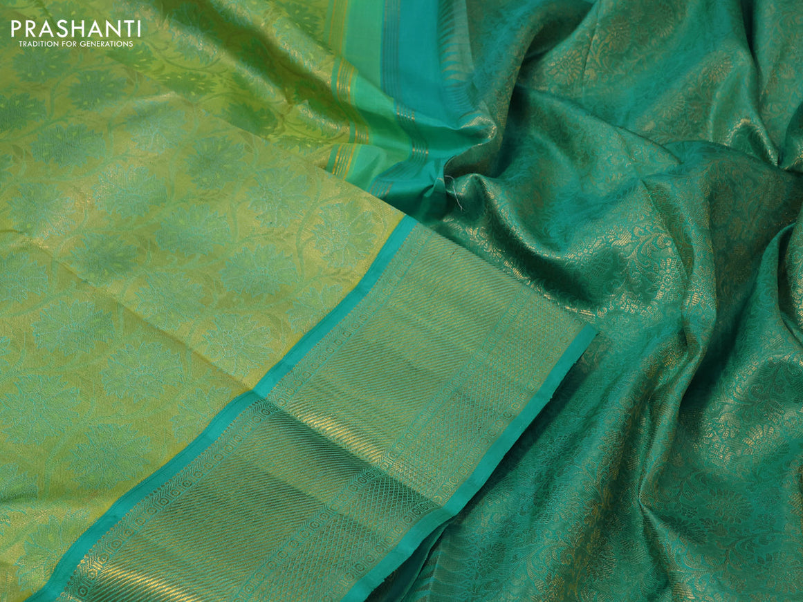 Pure kanchipuram tissue silk saree light green and teal blue with allover zari woven brocade weaves and zari woven border