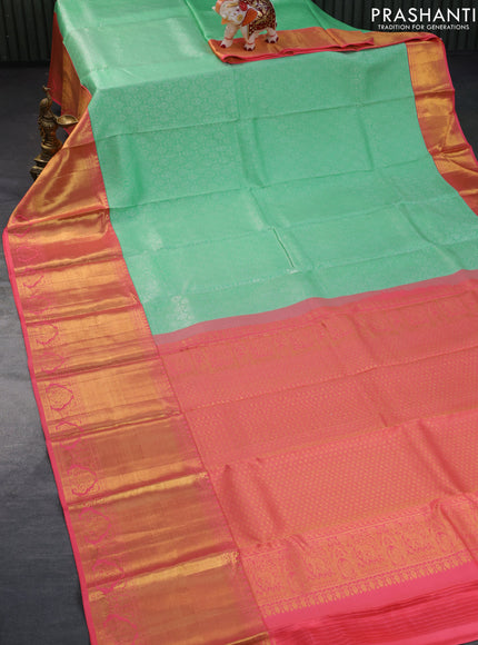 Pure kanchipuram silk saree teal green shade and pink with allover silver zari woven brocade weaves and long zari woven border