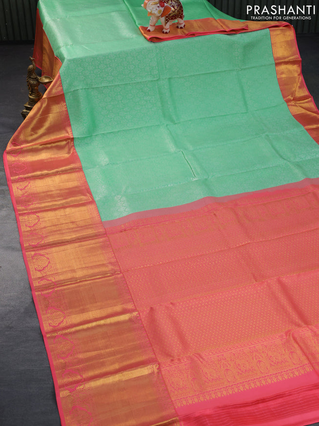 Pure kanchipuram silk saree teal green shade and pink with allover silver zari woven brocade weaves and long zari woven border