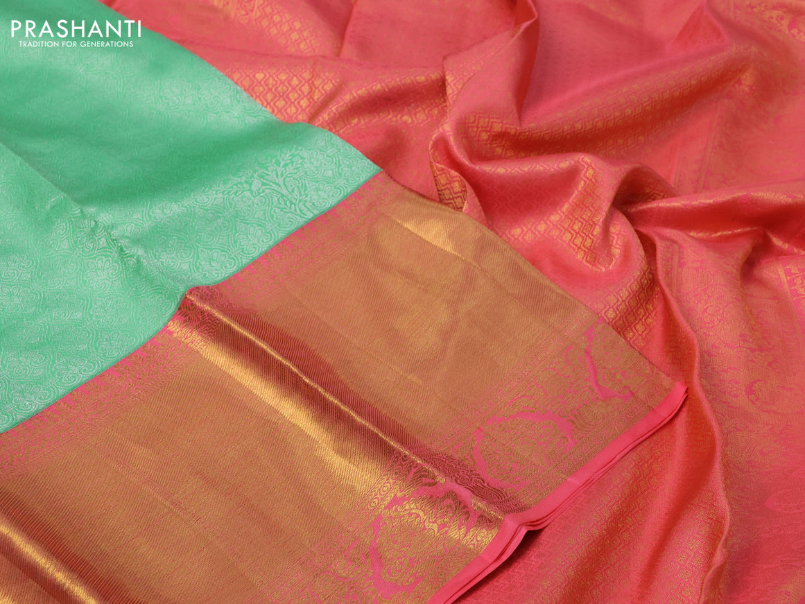 Pure kanchipuram silk saree teal green shade and pink with allover silver zari woven brocade weaves and long zari woven border