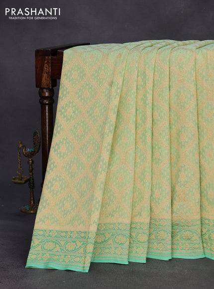 Banarasi georgette silk saree pista green and teal green with allover zari weaves and zari woven border