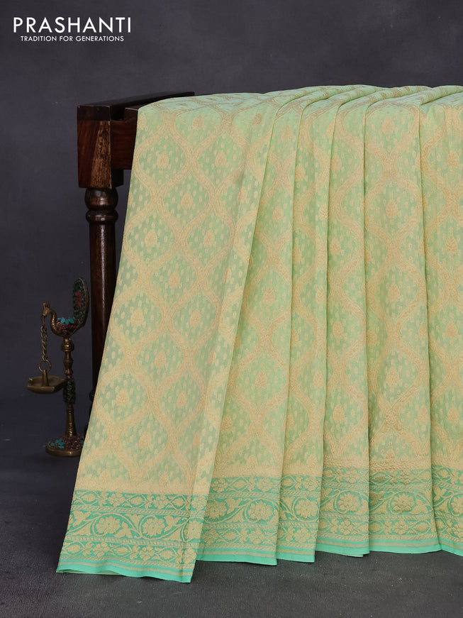 Banarasi georgette silk saree pista green and teal green with allover zari weaves and zari woven border