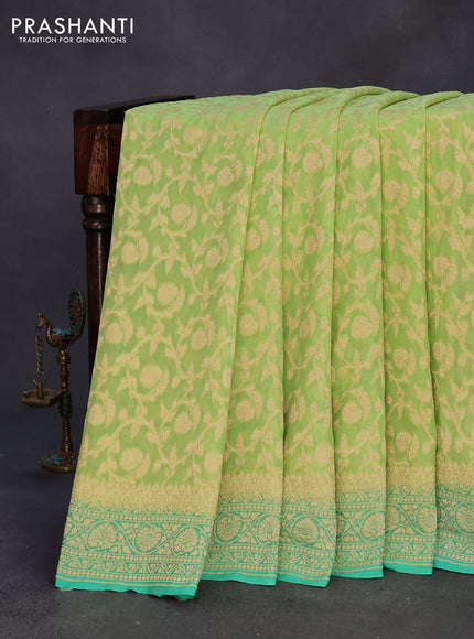 Banarasi georgette silk saree pista green and teal green with allover zari weaves and zari woven border