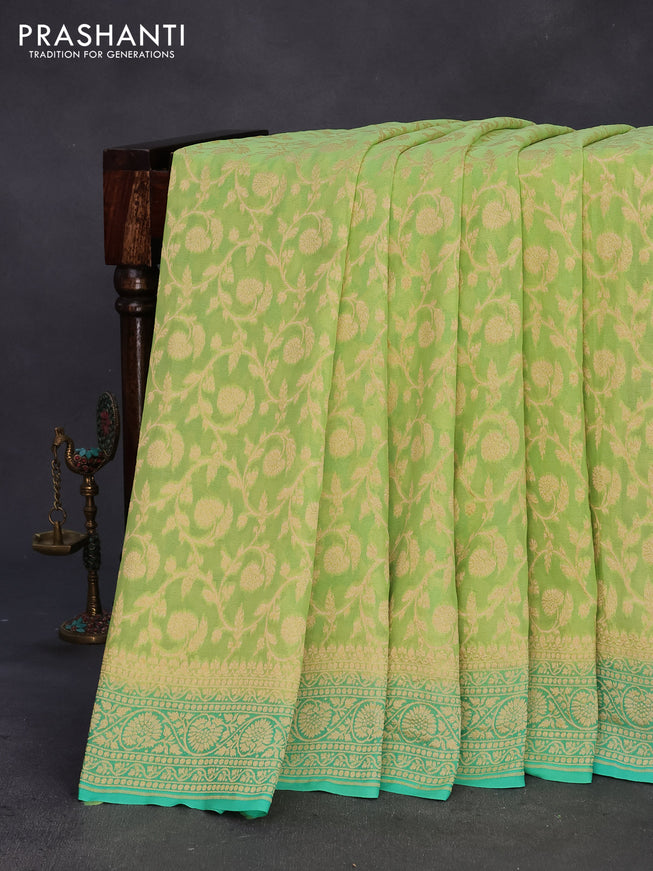 Banarasi georgette silk saree pista green and teal green with allover zari weaves and zari woven border