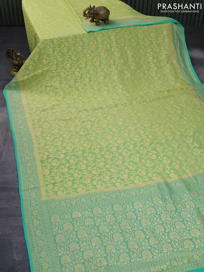 Banarasi georgette silk saree pista green and teal green with allover zari weaves and zari woven border