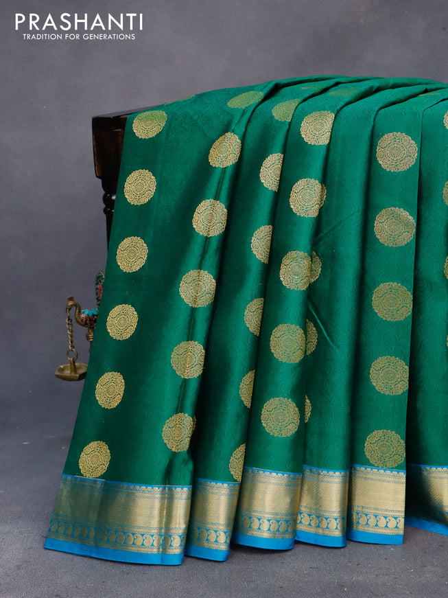 Pure kanchipuram silk saree green and cs blue with allover self emboss & zari buttas and zari woven border