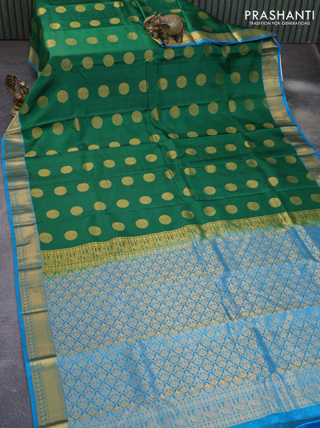 Pure kanchipuram silk saree green and cs blue with allover self emboss & zari buttas and zari woven border