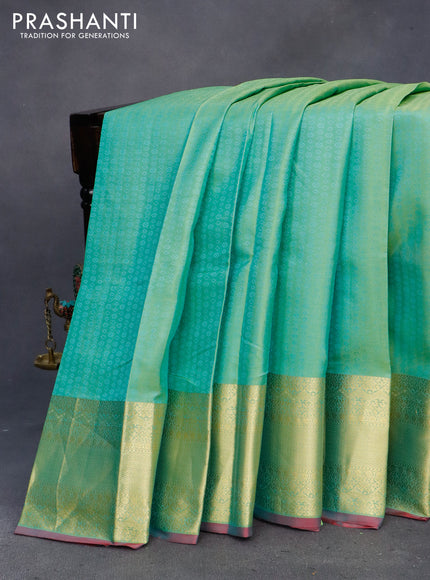 Pure kanchipuram silk saree teal green shade and dual shade of pink with allover self emboss and zari woven border