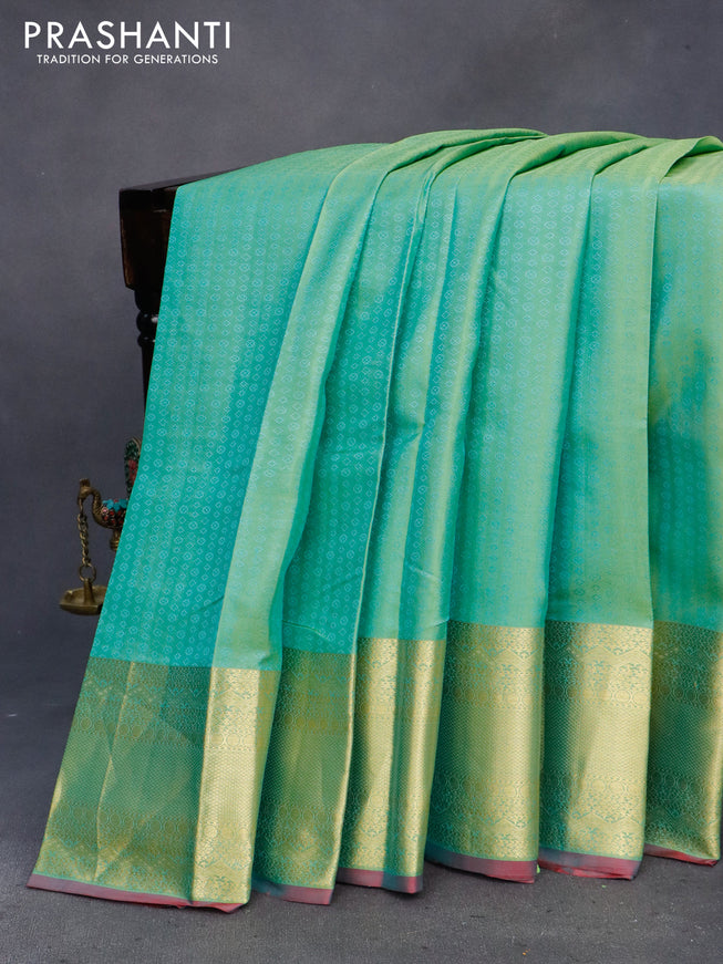 Pure kanchipuram silk saree teal green shade and dual shade of pink with allover self emboss and zari woven border