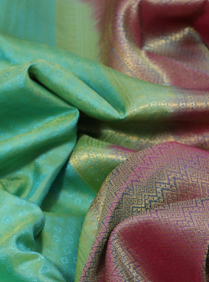 Pure kanchipuram silk saree teal green shade and dual shade of pink with allover self emboss and zari woven border