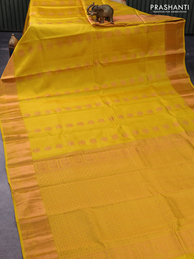 Pure kanchipuram silk saree yellow with copper zari woven buttas and copper zari woven border