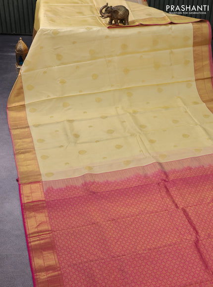 Pure kanchipuram silk saree pale yellow and pink with allover self emboss & zari buttas and zari woven border