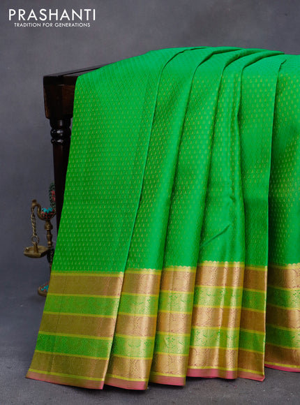 Pure kanchipuram silk saree light green and pink with allover self emboss and zari woven border