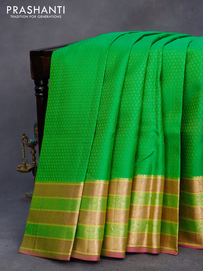 Pure kanchipuram silk saree light green and pink with allover self emboss and zari woven border