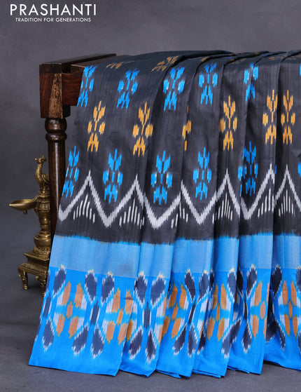 Pochampally silk saree black and cs blue with allover ikat butta weaves and long zari woven ikat border