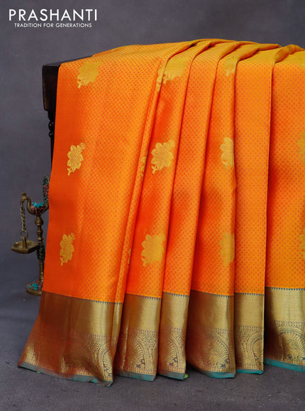 Pure kanchipuram silk saree dual shade of mango yellow and teal green with allover self emboss & zari buttas and zari woven border