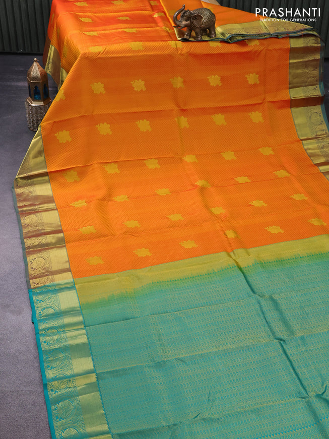 Pure kanchipuram silk saree dual shade of mango yellow and teal green with allover self emboss & zari buttas and zari woven border