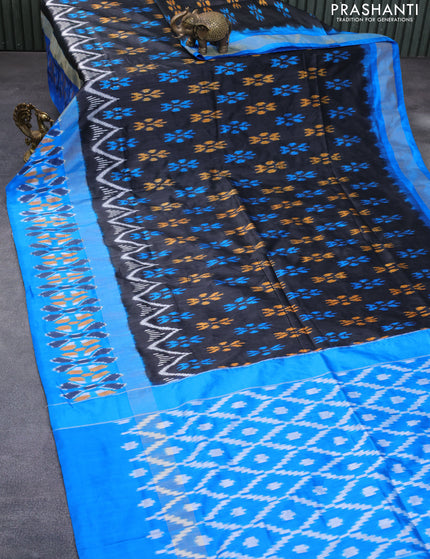 Pochampally silk saree black and cs blue with allover ikat butta weaves and long zari woven ikat border