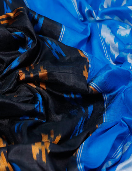 Pochampally silk saree black and cs blue with allover ikat butta weaves and long zari woven ikat border