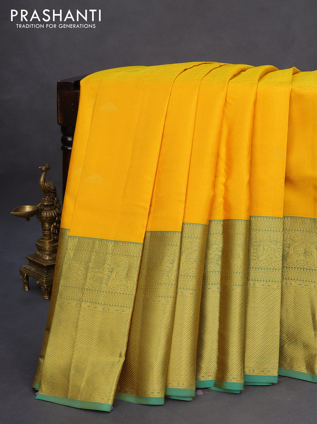 Pure kanchipuram silk saree mango yellow and dual shade of teal green with allover self emboss & zari buttas and long zari woven border