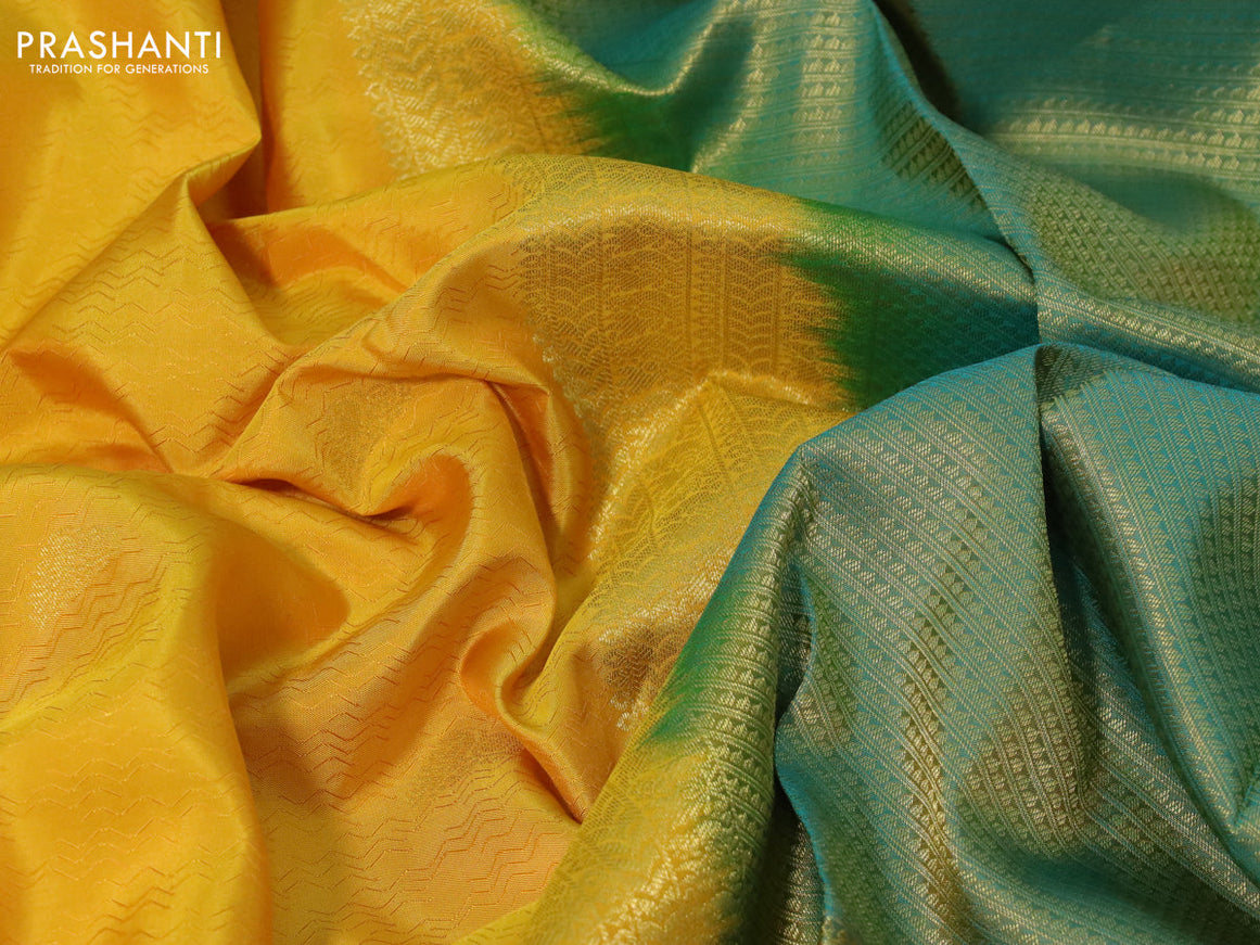 Pure kanchipuram silk saree mango yellow and dual shade of teal green with allover self emboss & zari buttas and long zari woven border