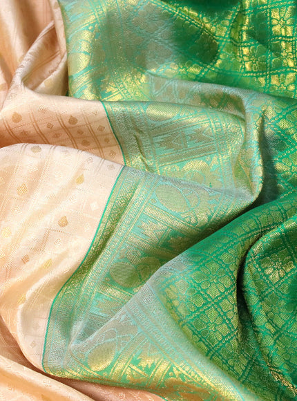 Pure kanchipuram silk saree cream and green with allover self emboss & zari buttas and long zari woven border