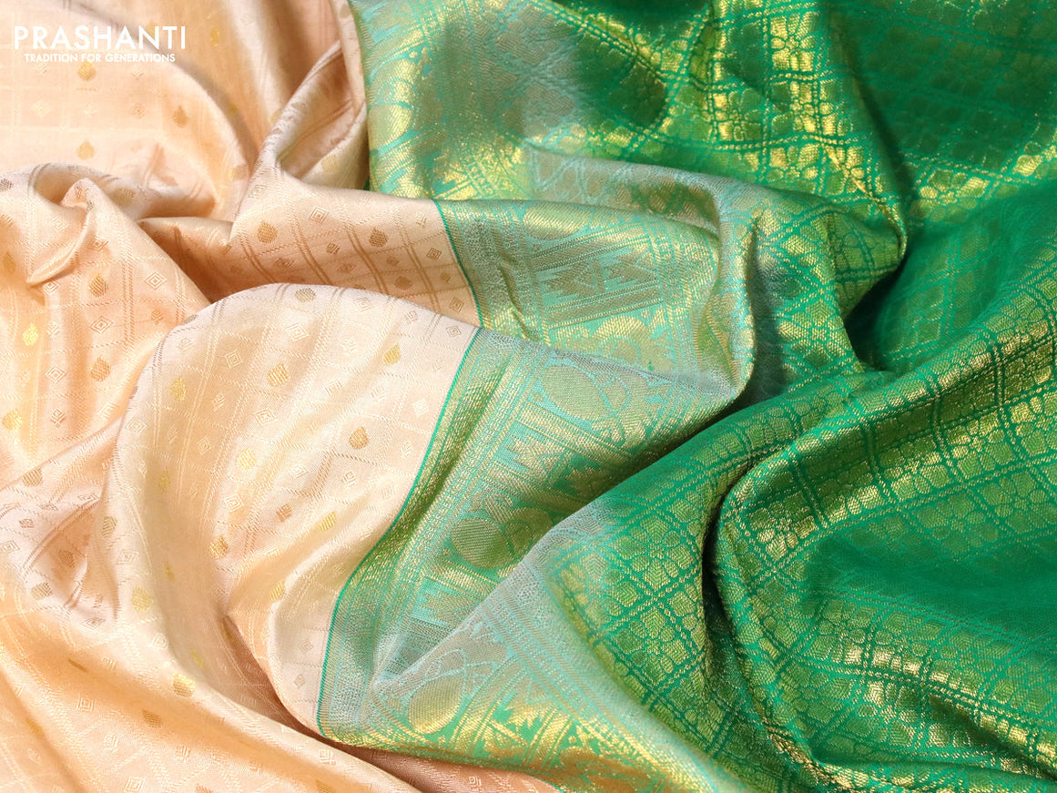 Pure kanchipuram silk saree cream and green with allover self emboss & zari buttas and long zari woven border