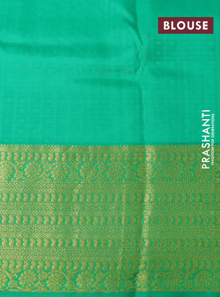 Pure kanchipuram silk saree cream and green with allover self emboss & zari buttas and long zari woven border