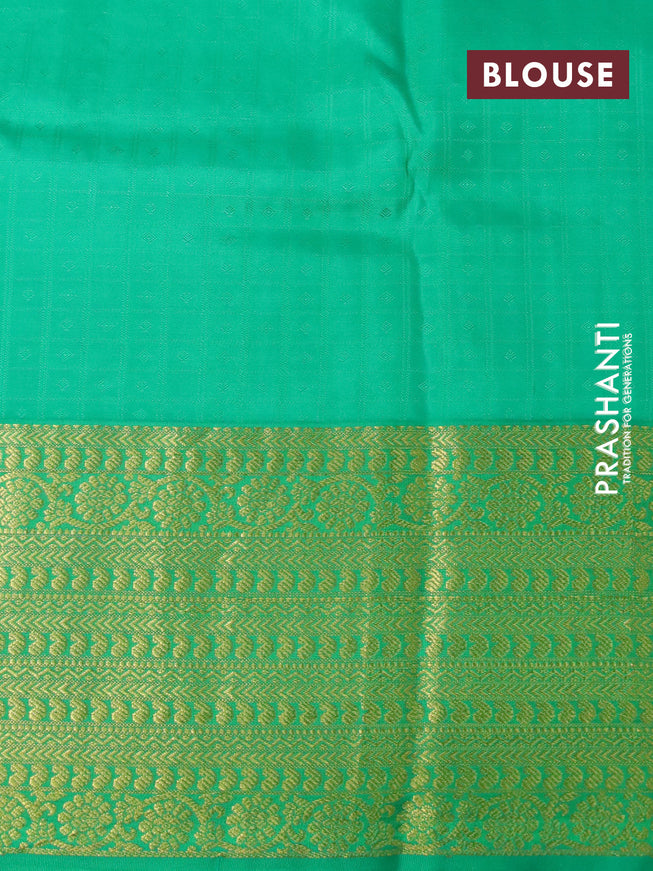 Pure kanchipuram silk saree cream and green with allover self emboss & zari buttas and long zari woven border