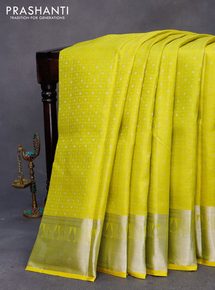 Pure kanchipuram silk saree lime yellow and pink with allover self emboss & buttas and silver zari woven border