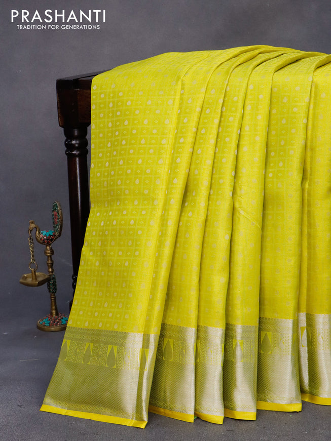 Pure kanchipuram silk saree lime yellow and pink with allover self emboss & buttas and silver zari woven border