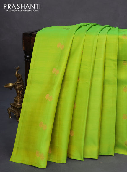 Pure kanchipuram silk saree light green and dual shade of pinkish orange with copper zari woven buttas in borderless style