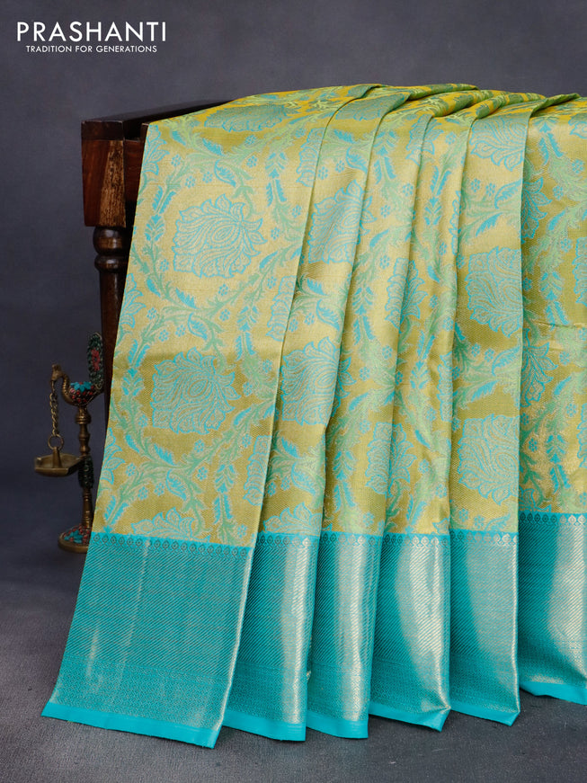 Pure kanchipuram tissue silk saree yellow and teal blue with allover zari woven brocade weaves and zari woven border