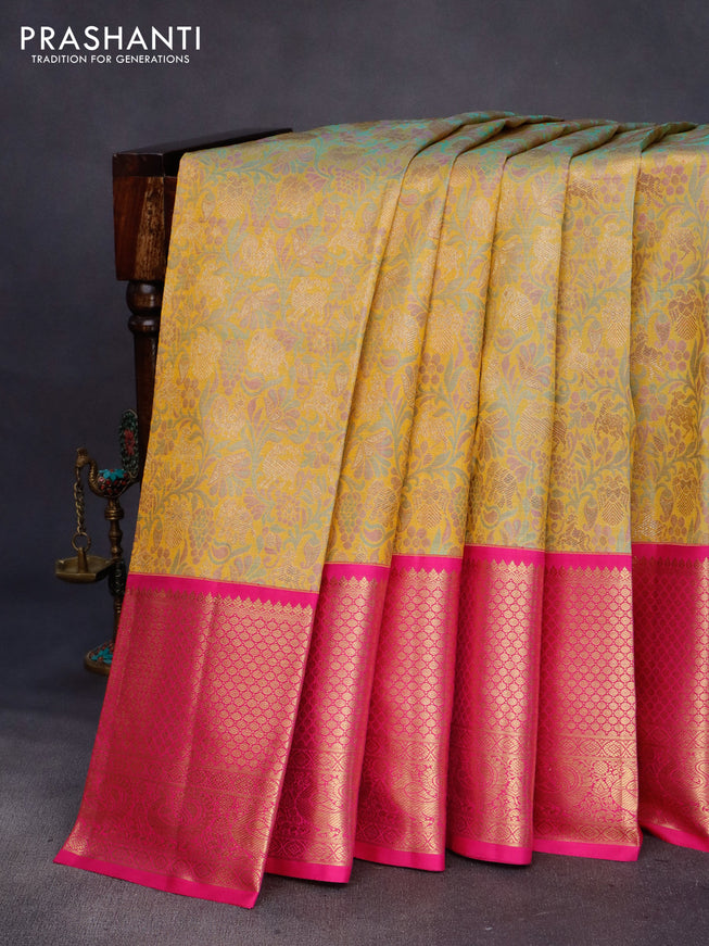 Pure kanchipuram tissue silk saree mustard shade and pink with allover zari woven brocade weaves and long annam zari woven border