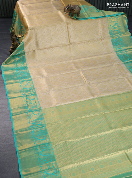 Pure kanchipuram tissue silk saree gold and teal blue with allover zari woven brocade weaves and long rich zari woven border