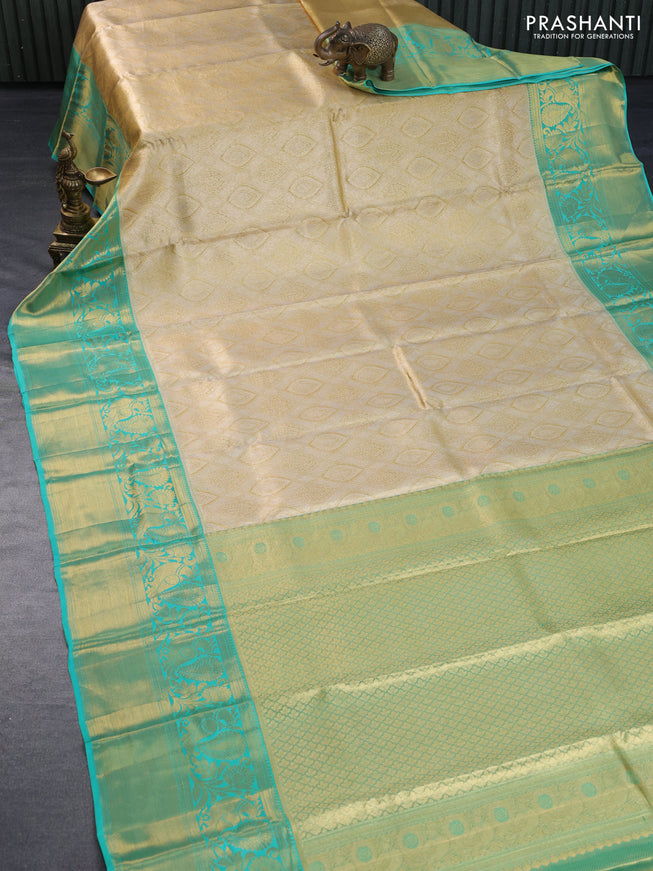 Pure kanchipuram tissue silk saree gold and teal blue with allover zari woven brocade weaves and long rich zari woven border