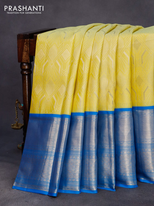 Pure kanchipuram silk saree lime yellow and cs blue with allover zari weaves and long zari woven border